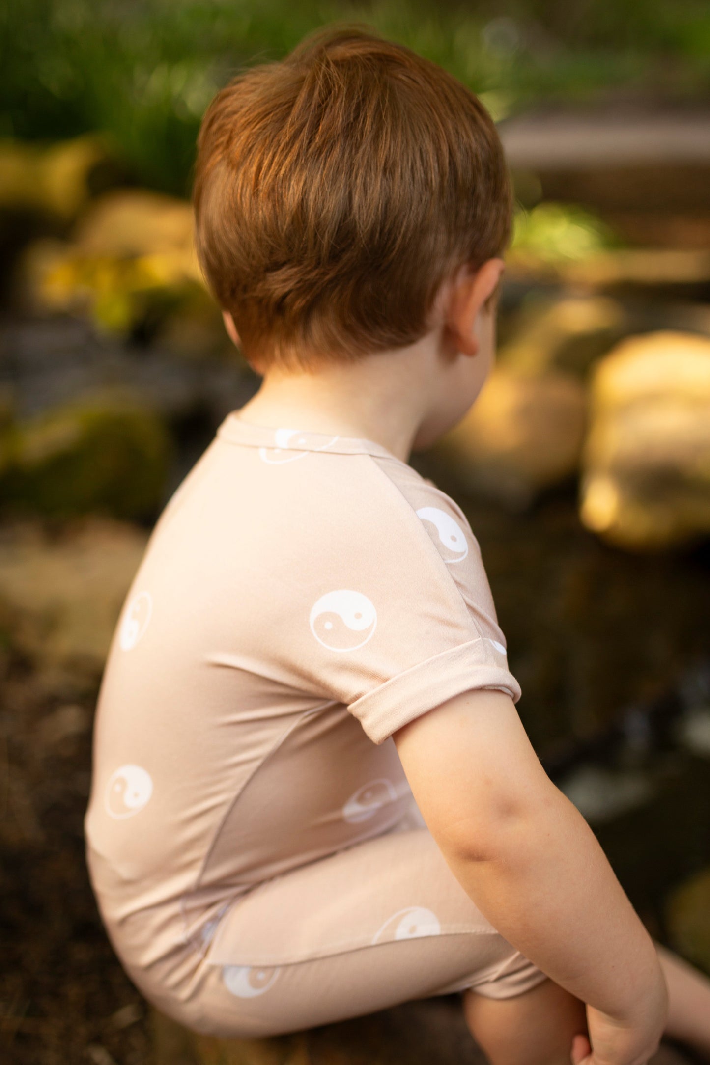 yin yang beige and white gender neutral bamboo baby romper