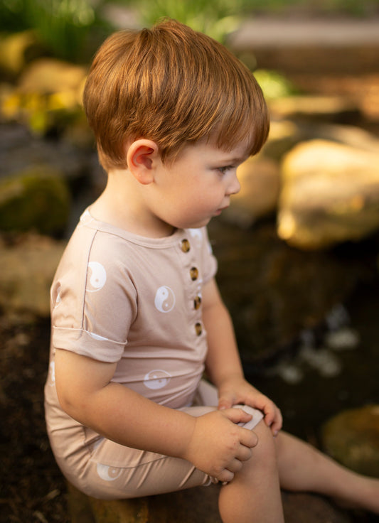 yin yang beige and white gender neutral bamboo baby romper